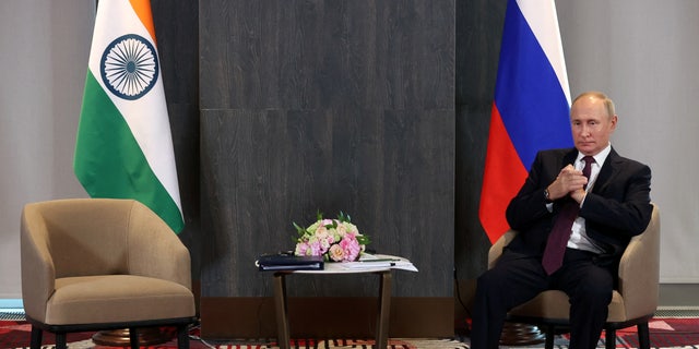 Russian President Vladimir Putin waits before a meeting with Indian Prime Minister Narendra Modi on the sidelines of the Shanghai Cooperation Organization (SCO) summit in Samarkand, Uzbekistan September 16, 2022. 