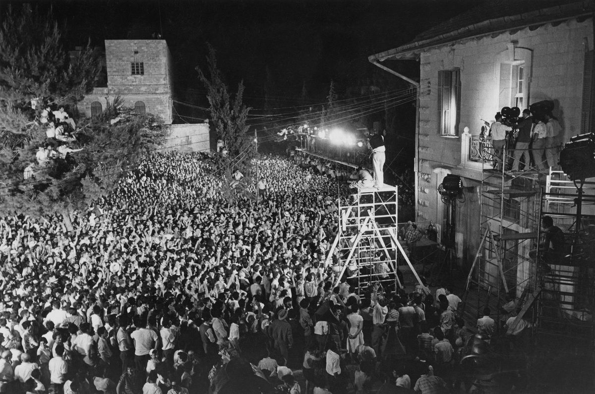 Filming a crowd scene for the Otto Preminger film Exodus in 1959.