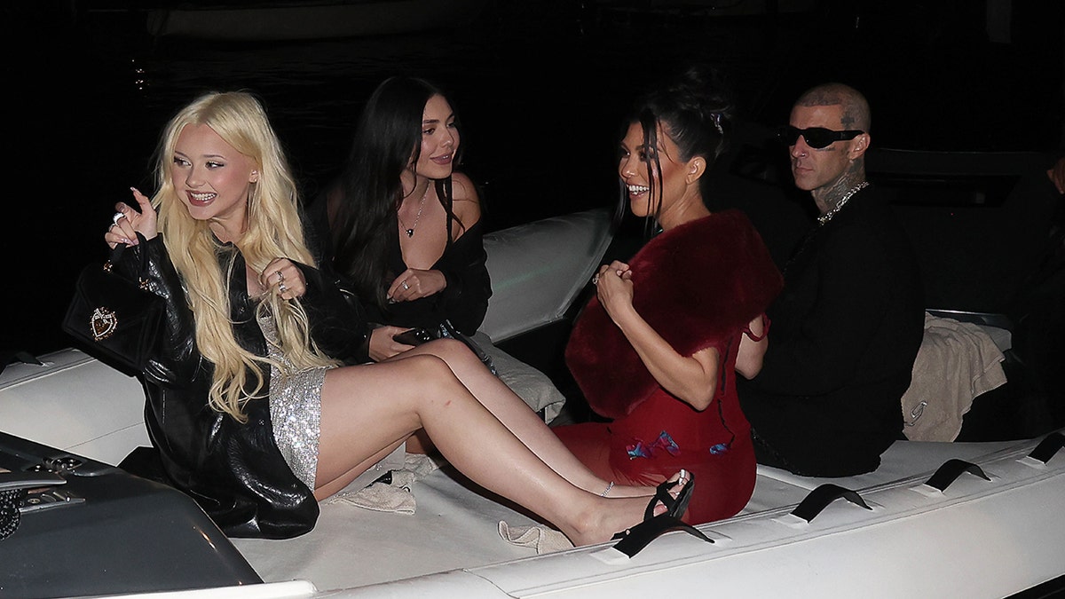 Kourtney and Travis plus the kids