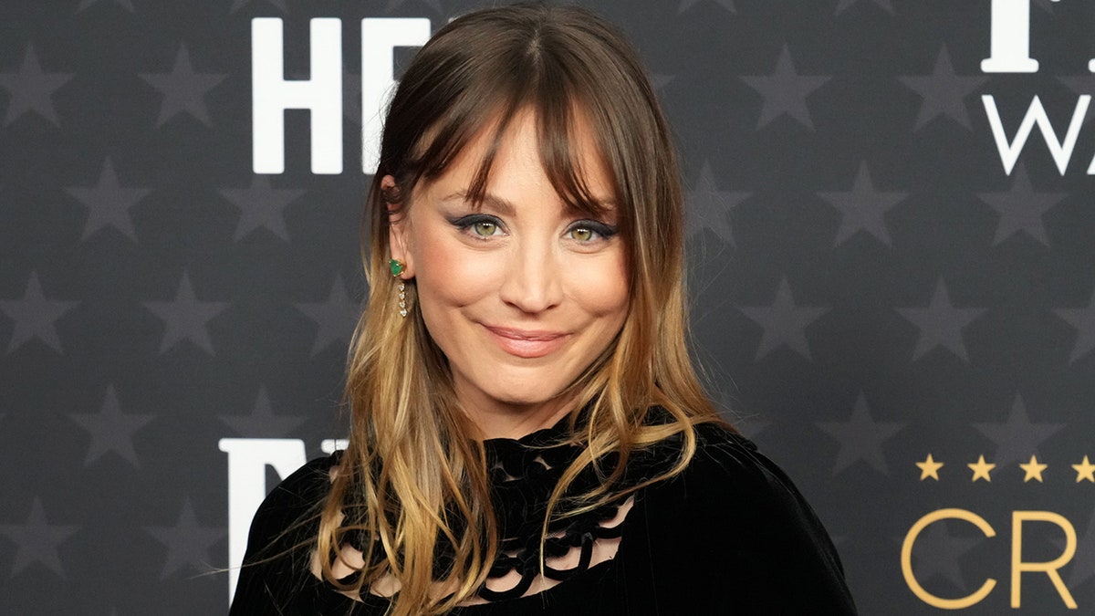 Kaley Cuoco soft smiles with ombré hair (dark on top light on bottom) at the Critics Choice Awards carpet