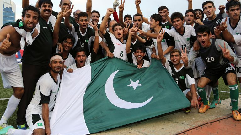 Members and support staff of Pakistan&#39;s team celebrate their win after the last match of the two-match friendly soccer tournament between India and Pakistan in Bangalore, India, Wednesday, Aug. 20, 2014. Pakistan won the match 2-0 to level the series. (AP Photo/Aijaz Rahi) 