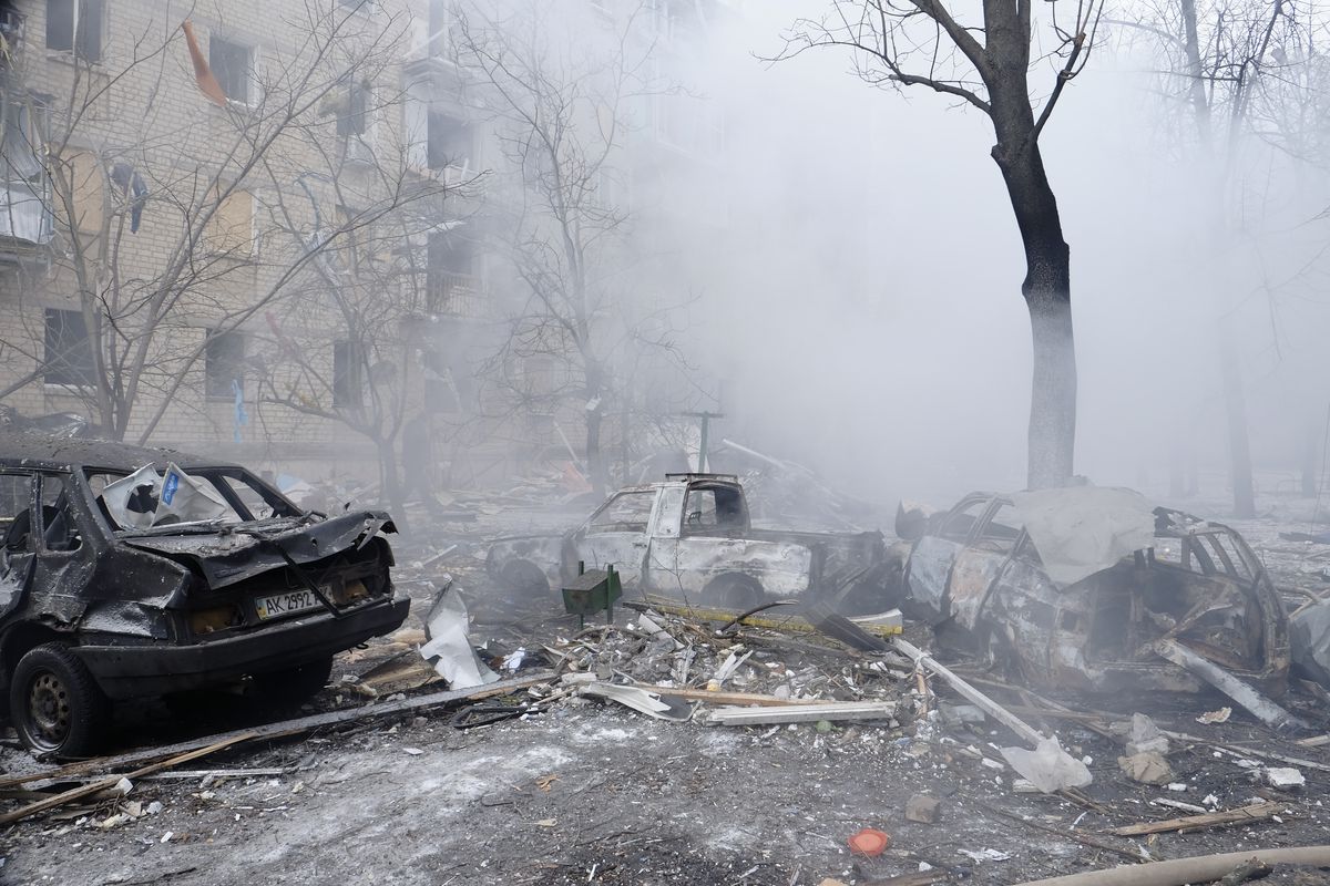 Burned cars stand in the courtyard of a residential high-rise building after a Russian missile attack on January 23, 2024, in Kharkiv, Ukraine.