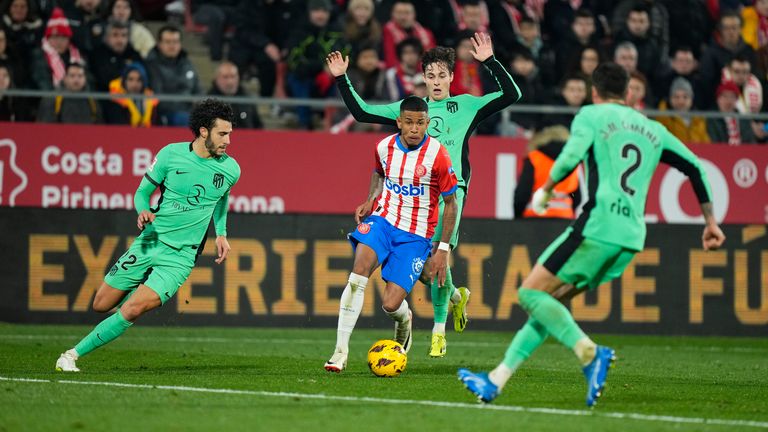Savio (Girona FC) duels for the ball against Hermoso (Atletico de Madrid) (l) during La Liga football match between Girona FC and Atletico de Madrid, at Montilivi Stadium on January 3, 2024 in Girona, Spain