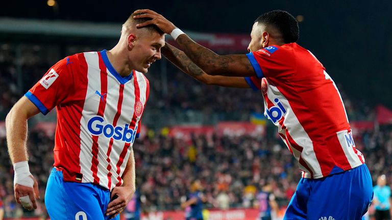 Artem Dovbyk (Girona FC) celebrates with his teammate Savio (Girona FC) after scoring during La Liga football match between Girona FC and Sevilla FC, at Montilivi Stadium on January 21, 2024 in Girona, Spain.