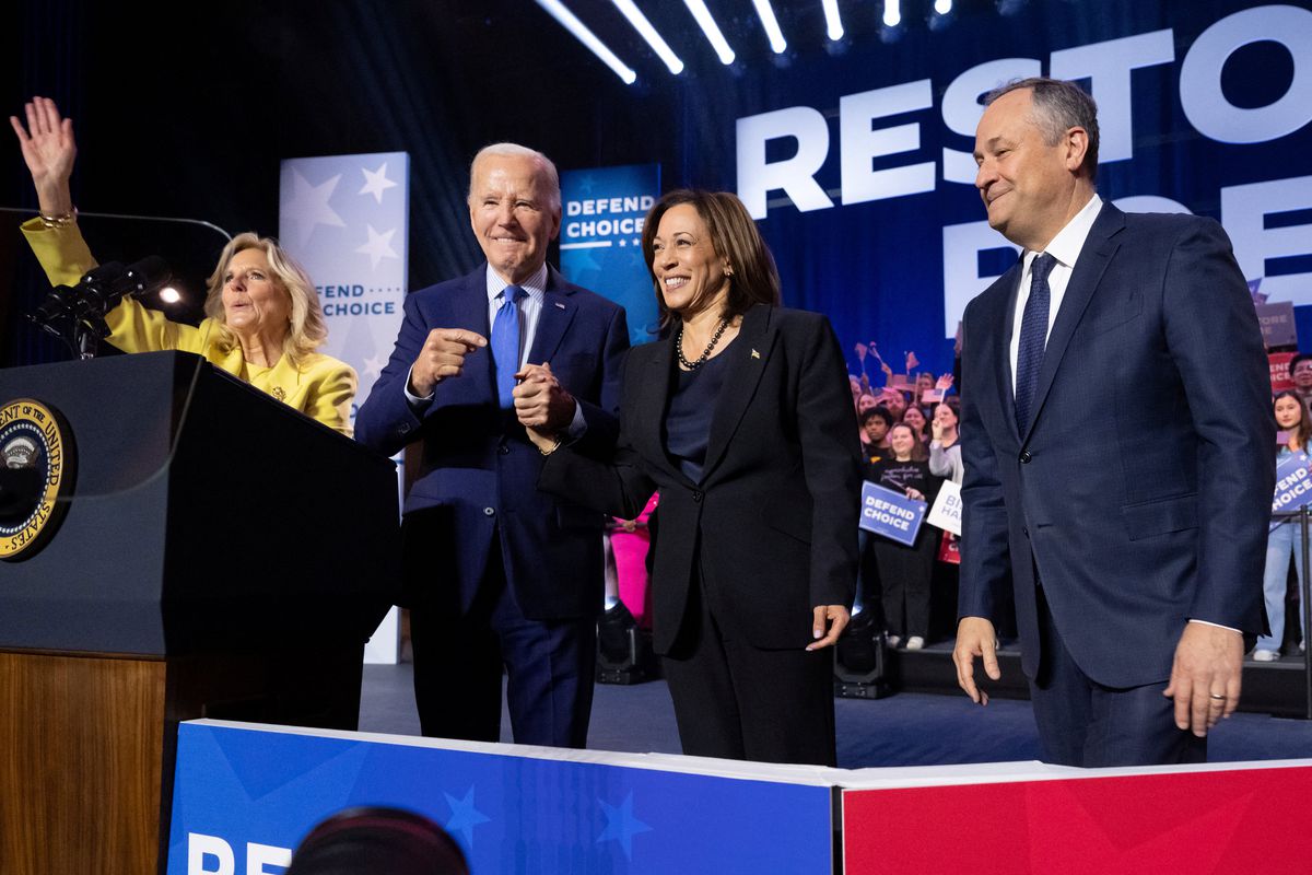 They stand in a line onstage in front of signs saying “restore Roe” and “defend choice.”