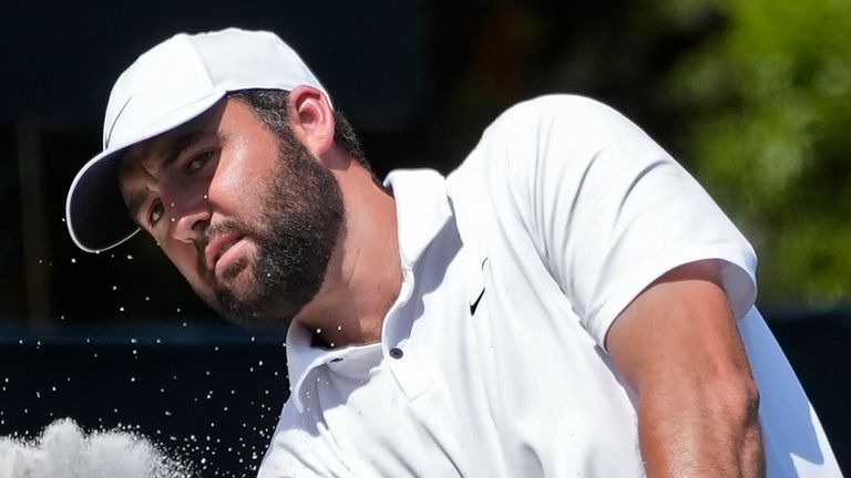 Scottie Scheffler hits out of the sand on the second green during the final round of The Players Championship golf tournament Sunday, March 17, 2024, in Ponte Vedra Beach, Fla. (AP Photo/Marta Lavandier)