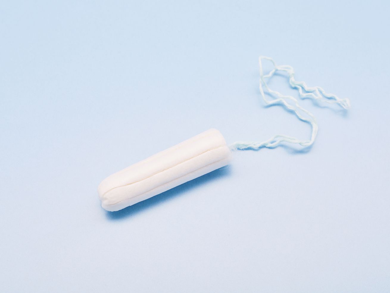 A tampon on a blue background