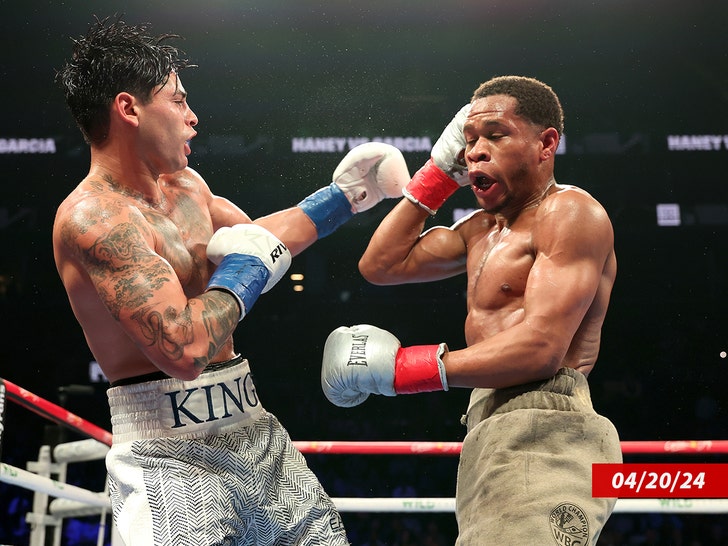 Ryan Garcia (white trunks) punches Devin Haney