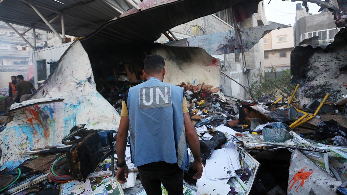 UN relief worker at site of destroyed school in Gaza