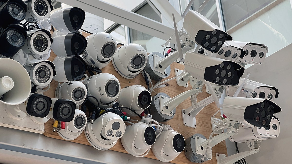Surveillance cameras mounted on plywood