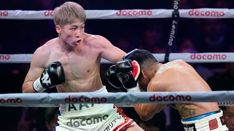 Naoya Inoue of Japan, left, and Marlon Tapales of the Philippines, right, fight in the first round of their boxing match for the unified WBA, WBC, WBO and IBF super bantamweight world titles in Tokyo, Tuesday, Dec. 26, 2023. (AP Photo/Hiro Komae)
