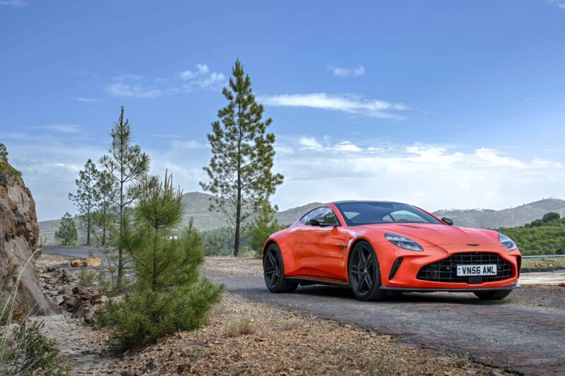 An orange Aston Martin Vantage in the Spanish countryside