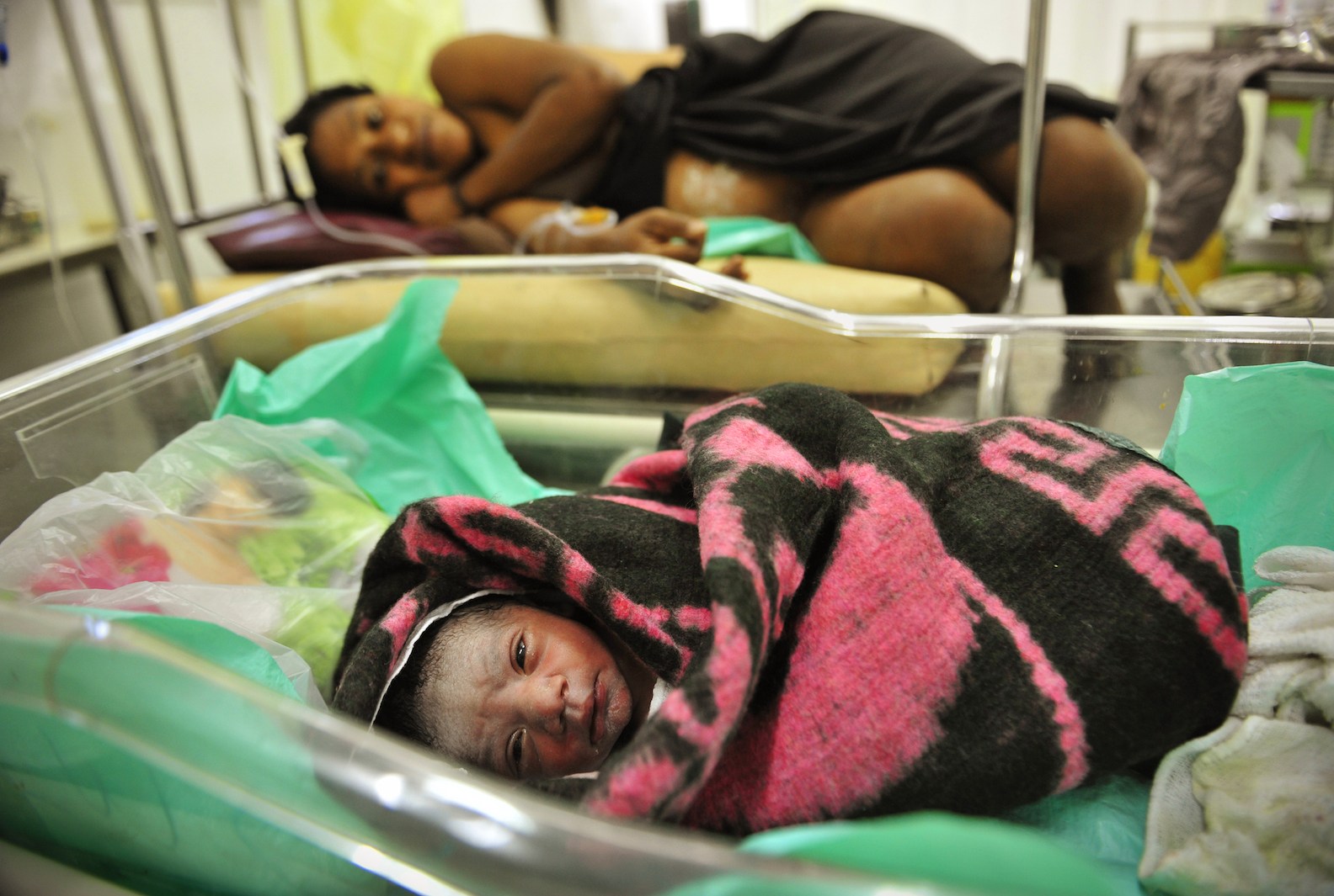 A woman with her newborn baby in the birthing suite at a hospital in Goroka in 2009. 