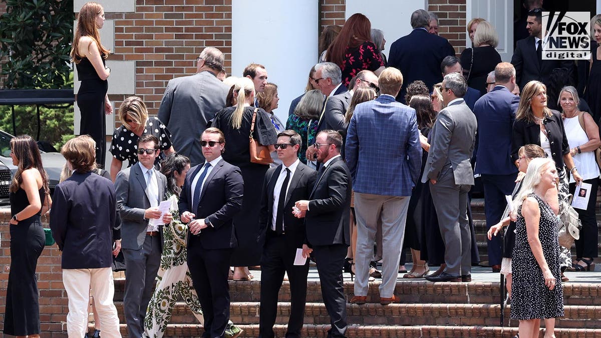 People attend a funeral a church for Johnny Wactor