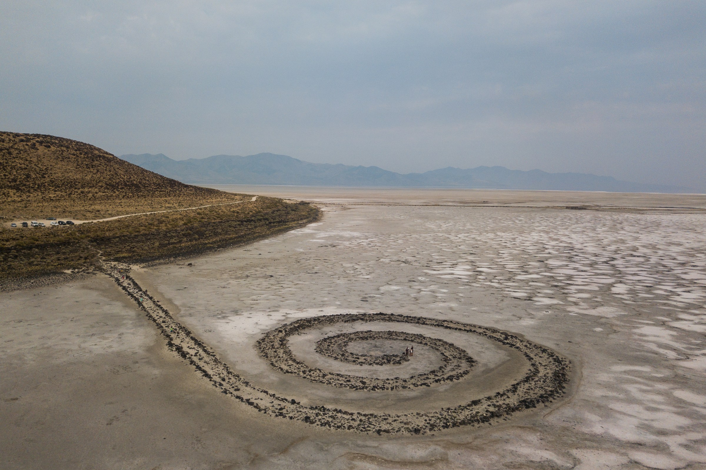 A large spiral shape formed in the sand.