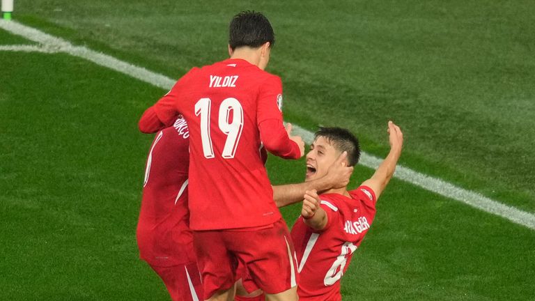 Turkey's Orkun Kokcu, right, celebrates after scoring his side's second goal during a Group F match between Turkey and Georgia at the Euro 2024 soccer tournament in Dortmund, Germany, Tuesday, June 18, 2024. (AP Photo/Andreea Alexandru)