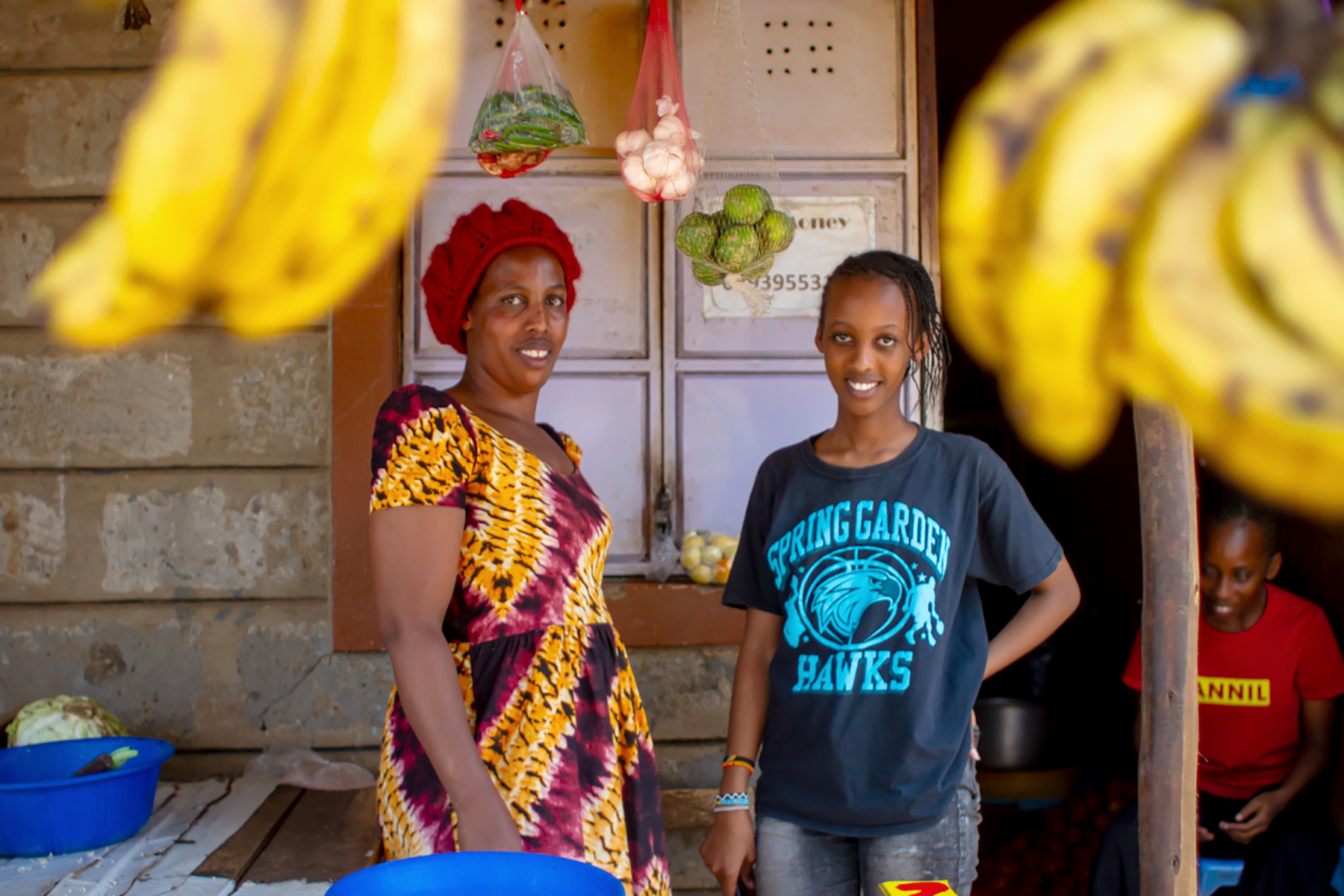 After school, Nakazungu’s 14-year-old daughter, Denise, helps her mother at her shop, the earnings from which help pay her school fees. Denise, who boasts the top marks in her class, showed off her language skills, speaking in Swahili, Kinyamulenge, English, and French.