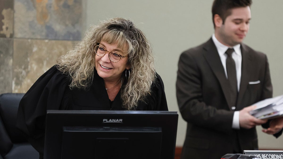 Judge Mary Kay Holthus smiles in courtroom