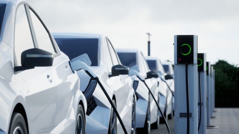 Generic electric car charging on a city street