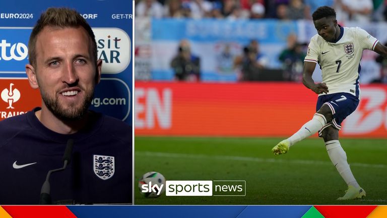 England's Bukayo Saka scores during the penalty shootout of a quarterfinal match between England and Switzerland at the Euro 2024 soccer tournament in Duesseldorf, Germany, Saturday, July 6, 2024. (AP Photo/Martin Meissner)


