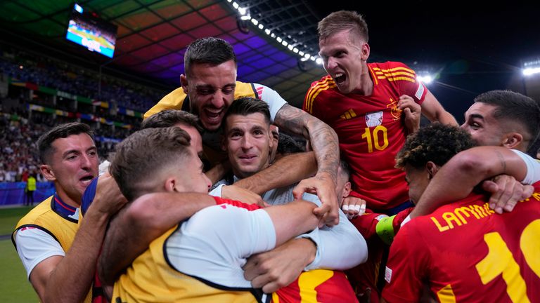 Spain players celebrate after Mikel Oyarzabal scored their side's second goal during the final match between Spain and England at the Euro 2024 soccer tournament in Berlin, Germany, Sunday, July 14, 2024. (AP Photo/Manu Fernandez)