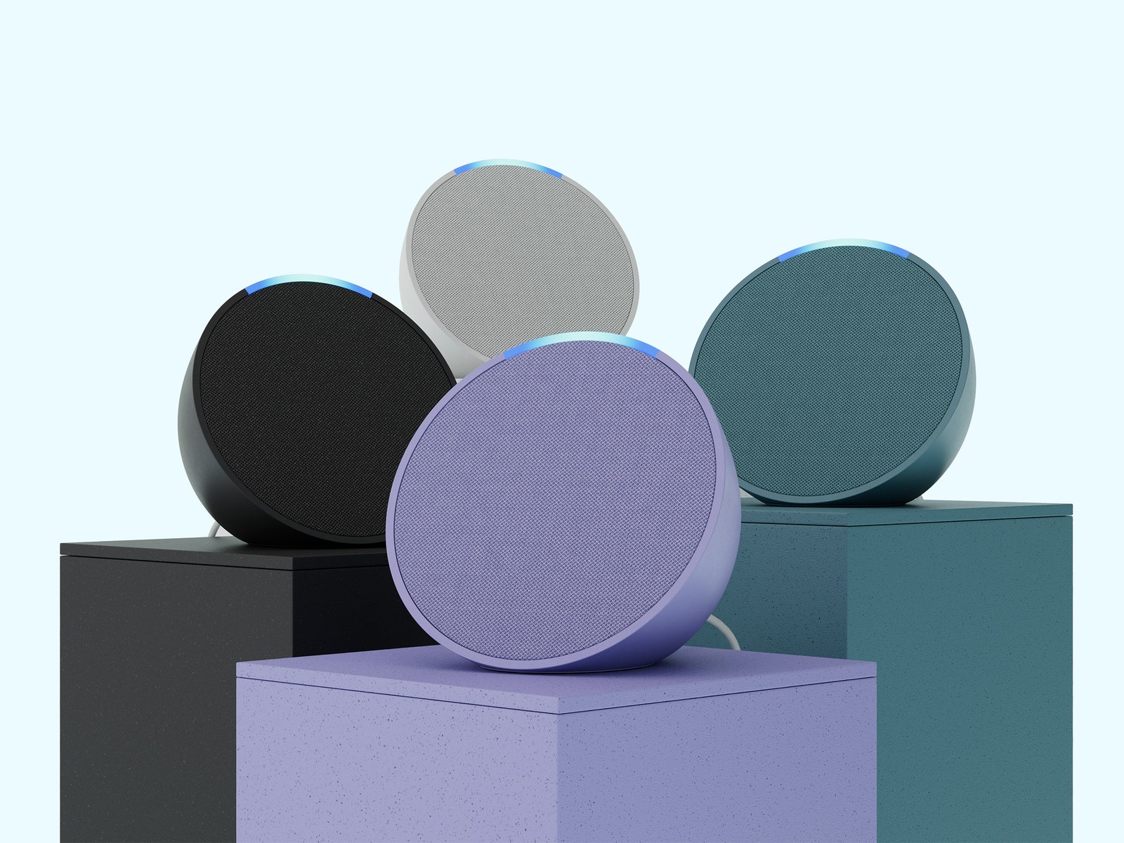 Amazon Echo Pop in various colors on platforms