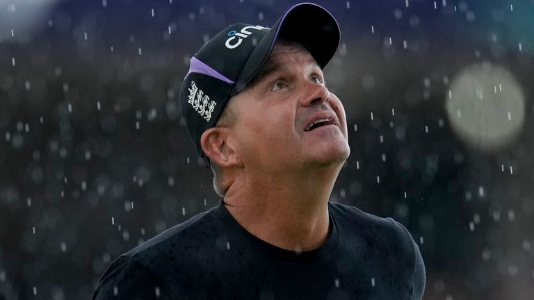 England's coach Matthew Mott looks up as rain falls and delays the start of an ICC Men's T20 World Cup cricket match against Namibia at Siv Vivian Richards Stadium in North Sound, Antigua and Barbuda, Saturday, June 15, 2024. (AP Photo/Ricardo Mazalan)