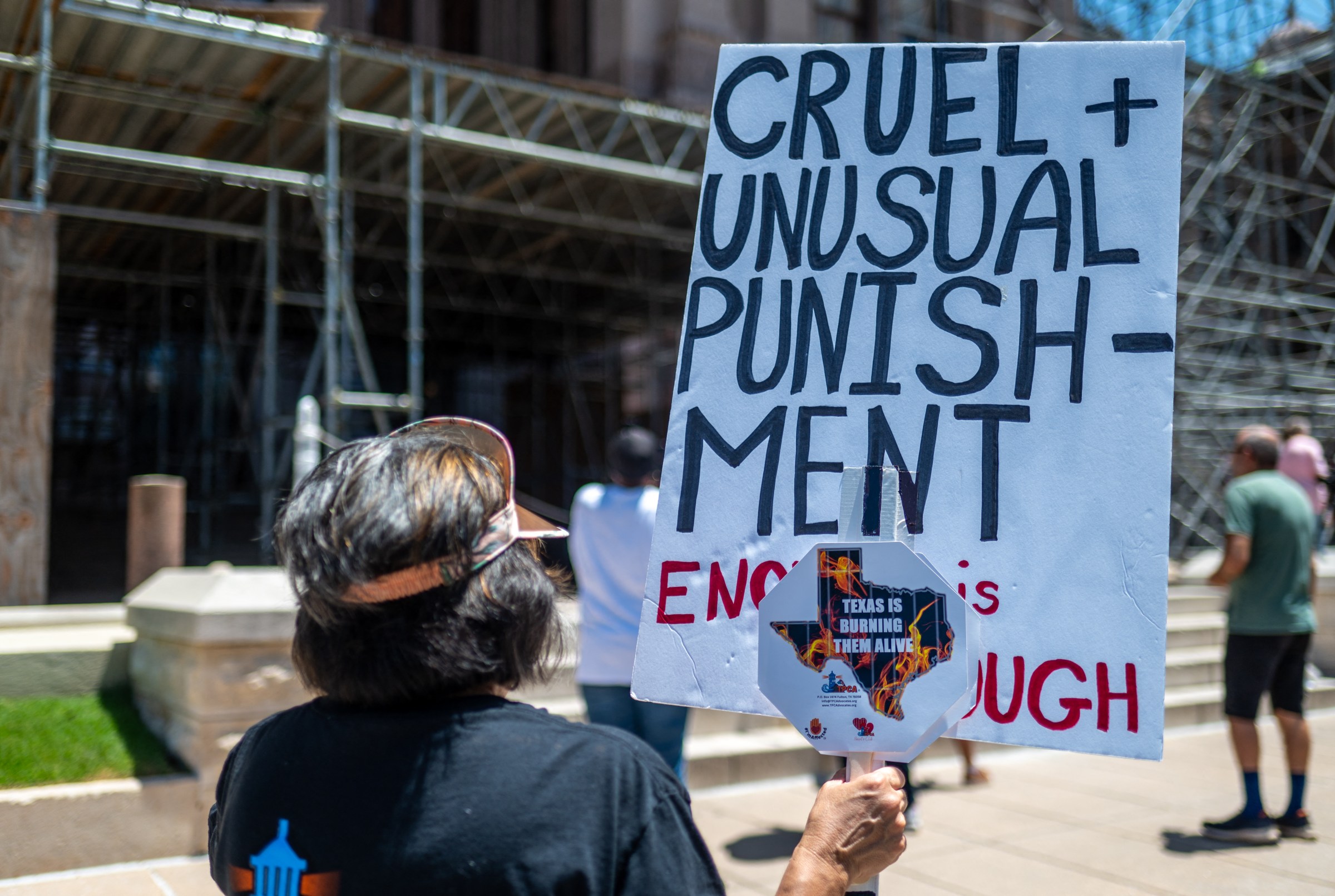 Protesters advocating for air conditioning in prisons gather outside the Texas State Capitol building in Austin, Texas, on July 18, 2023.