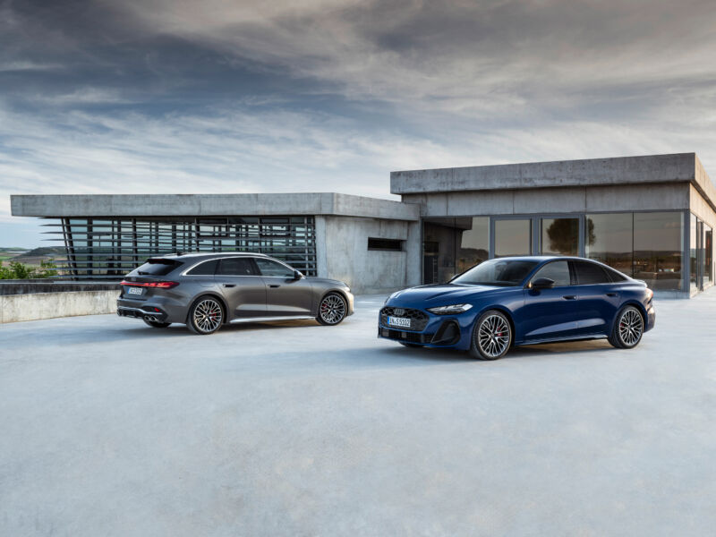 An Audi A5 sedan and A4 station wagon parked outside a modern house