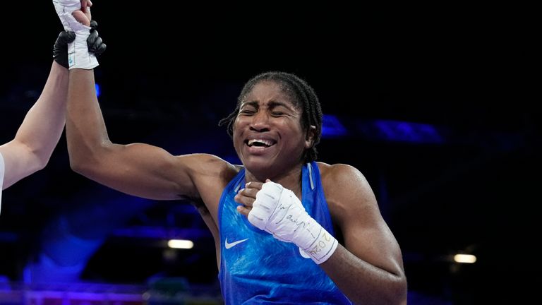 Refugee Olympic Team's Cindy Djankeu celebrates after defeating Canada's Tammara Thibeault in their women's 75 kg preliminary boxing match at the 2024 Summer Olympics, Wednesday, July 31, 2024, in Paris, France. (AP Photo/Ariana Cubillos)