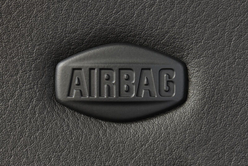 Macro of car airbag sign on leather