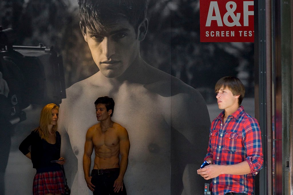 A model stands at the entrance of an Abercrombie & Fitch store in New York in 2010 in a photo that shows how the brand once marketed to young shoppers with an almost embarrassing amount of skin.