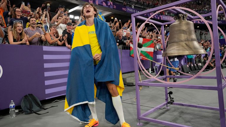 Armand Duplantis, of Sweden, reacts after setting a new world record in the men's pole vault final at the 2024 Summer Olympics, Monday, Aug. 5, 2024, in Saint-Denis, France. (AP Photo/Bernat Armangue)