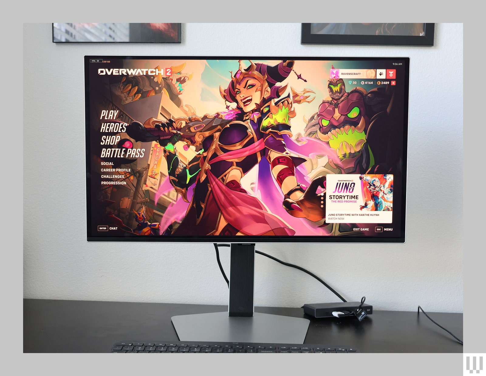 Desktop monitor with silver stand showing the titlescreen of an online game