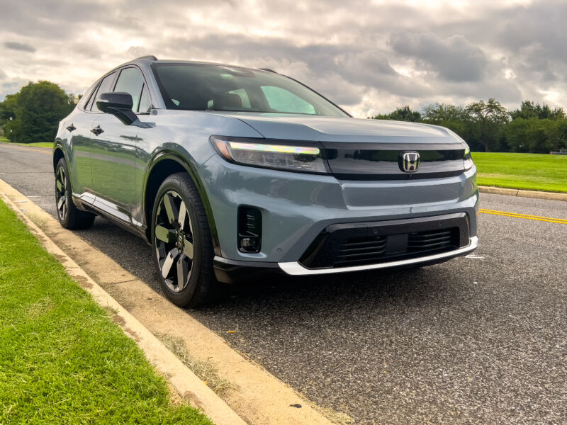 A grey Honda Prologue parked in a park