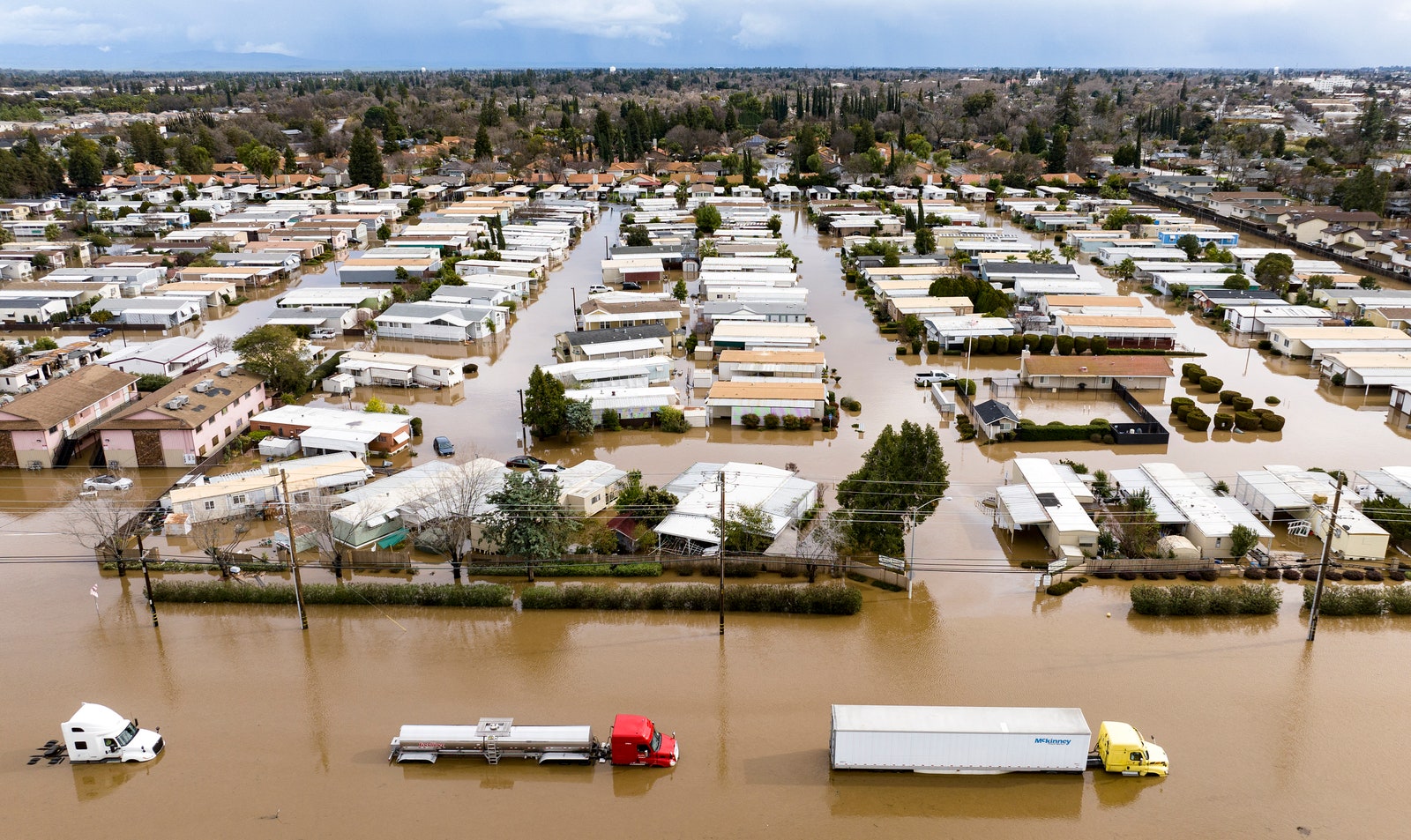 Image may contain Flood Water Architecture Building Transportation Truck and Vehicle