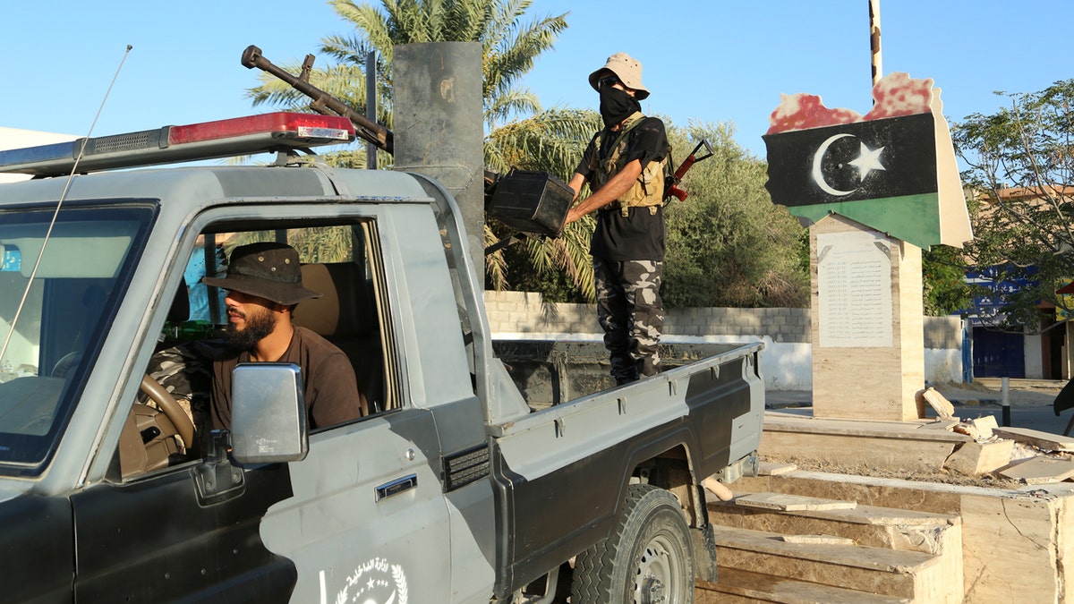 Libyan security forces stand guard in Tripoli, Libya, on Aug. 16, 2023.