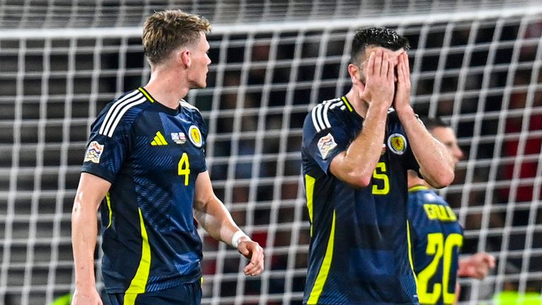 Scotland's Grant Hanley looks dejected after giving away a late penalty to Poland