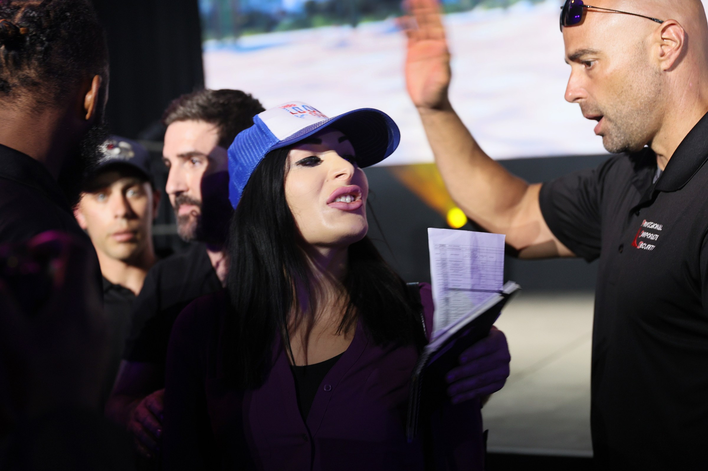 Laura Loomer is escorted out after interrupting Twitter’s Jack Dorsey as he spoke onstage at the Bitcoin 2021 Convention, a crypto-currency conference held at the Mana Convention Center in Wynwood on June 4, 2021, in Miami, Florida.