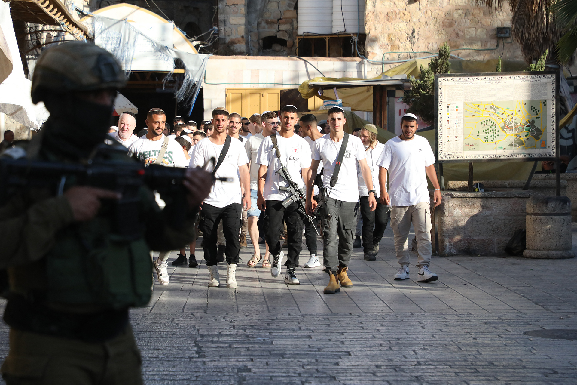 A group of Jewish settlers under the protection of Israeli soldiers raids the Old City area of Hebron, West Bank on September 14, 2024.