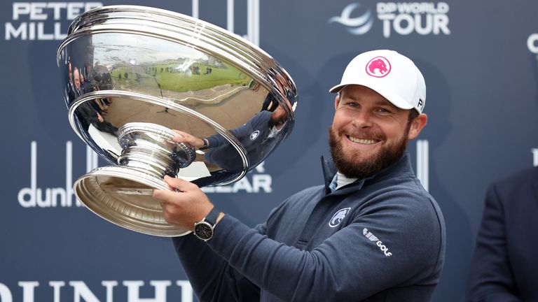 Tyrrell Hatton celebrates with the trophy after winning the Alfred Dunhill Links Championship