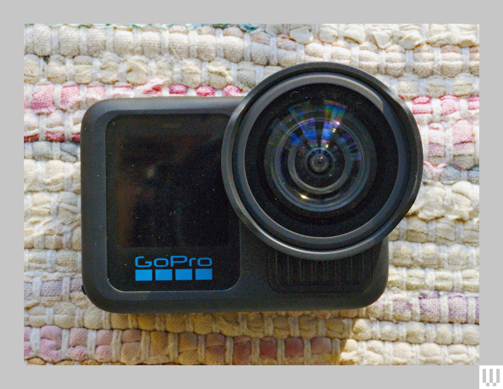 The GoPro Hero 13 Black a small camera with a  digital screen on the left and a circular lens on the right