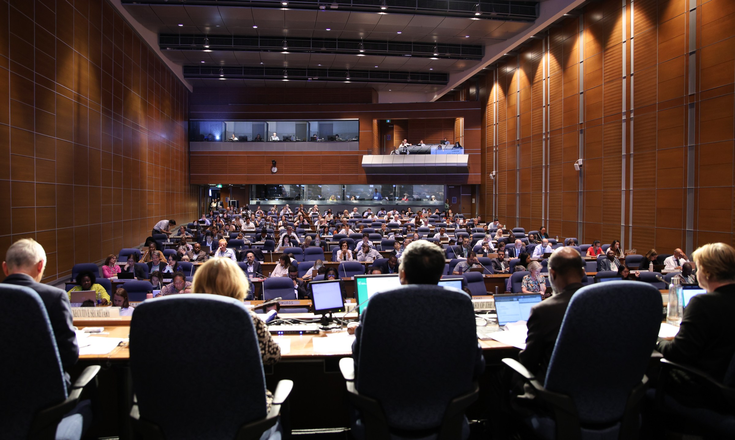 A large auditorium full of people.