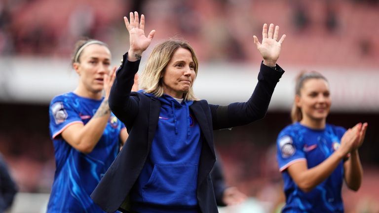 Chelsea celebrate on the Emirates pitch, led by coach Sonia Bompastor