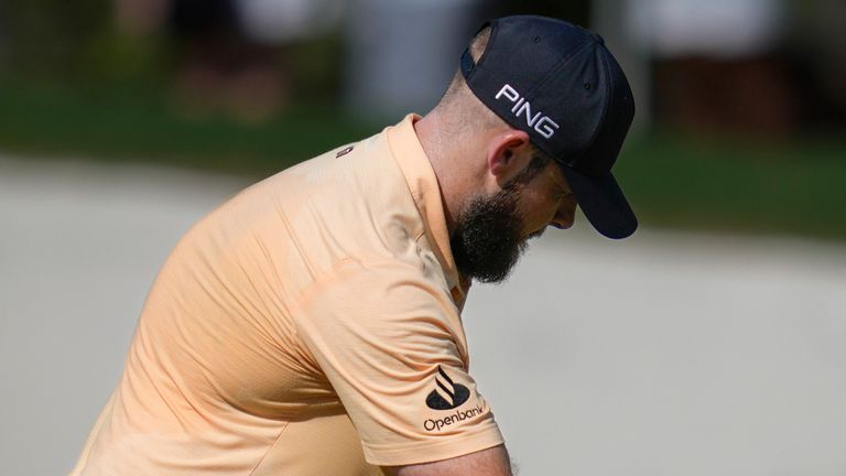 Tyrell Hatton of England reacts after he missed a shot on the 13th green during the second round of World Tour Golf Championship in Dubai, United Arab Emirates, Friday, Nov. 15, 2024. (AP Photo/Altaf Qadri) 