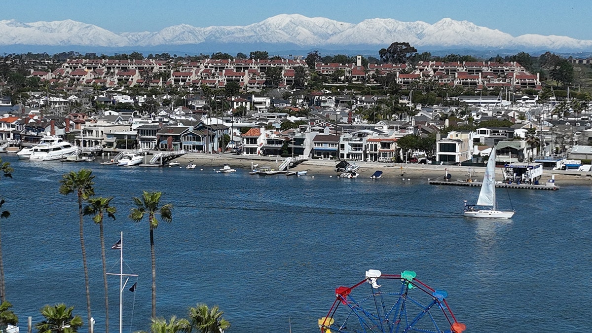 Aerial view of surf and sand in Newport Beach