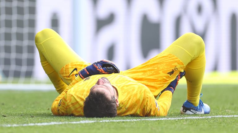 Alisson Becker goes down with a hamstring injury during the Premier League match against Crystal Palace