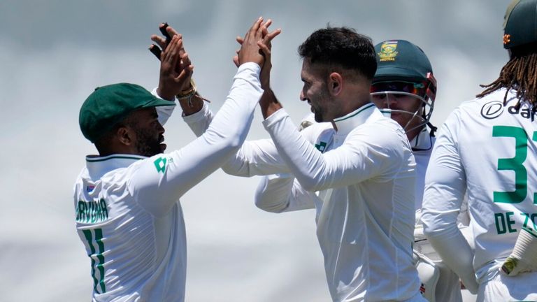 South Africa's Keshav Maharaj celebrates with captain Temba Bavuma, left, after dismissing Sri Lanka captain Dhananjaya de Silva (AP Photo/Themba Hadebe)