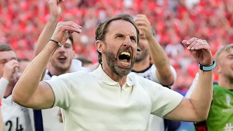 England's manager Gareth Southgate celebrates after winning the penalty shootout of a quarterfinal match between England and Switzerland at the Euro 2024 soccer tournament in Duesseldorf, Germany, Saturday, July 6, 2024. (AP Photo/Martin Meissner)