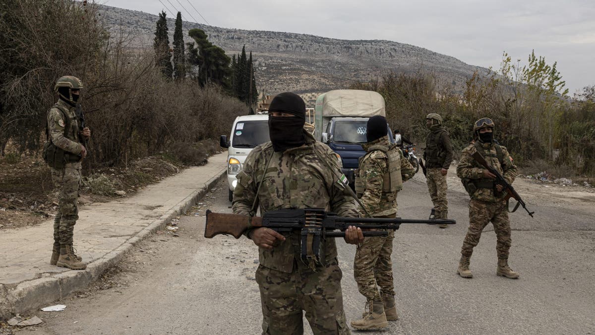 Displaced Kurds leave the refugee camp in the north of Aleppo, fleeing to Afrin, on Dec. 4, 2024.